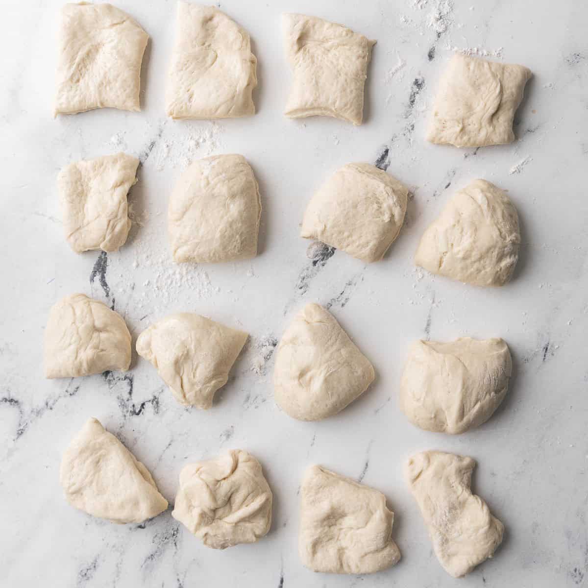 Dough divided into 16 equal pieces.