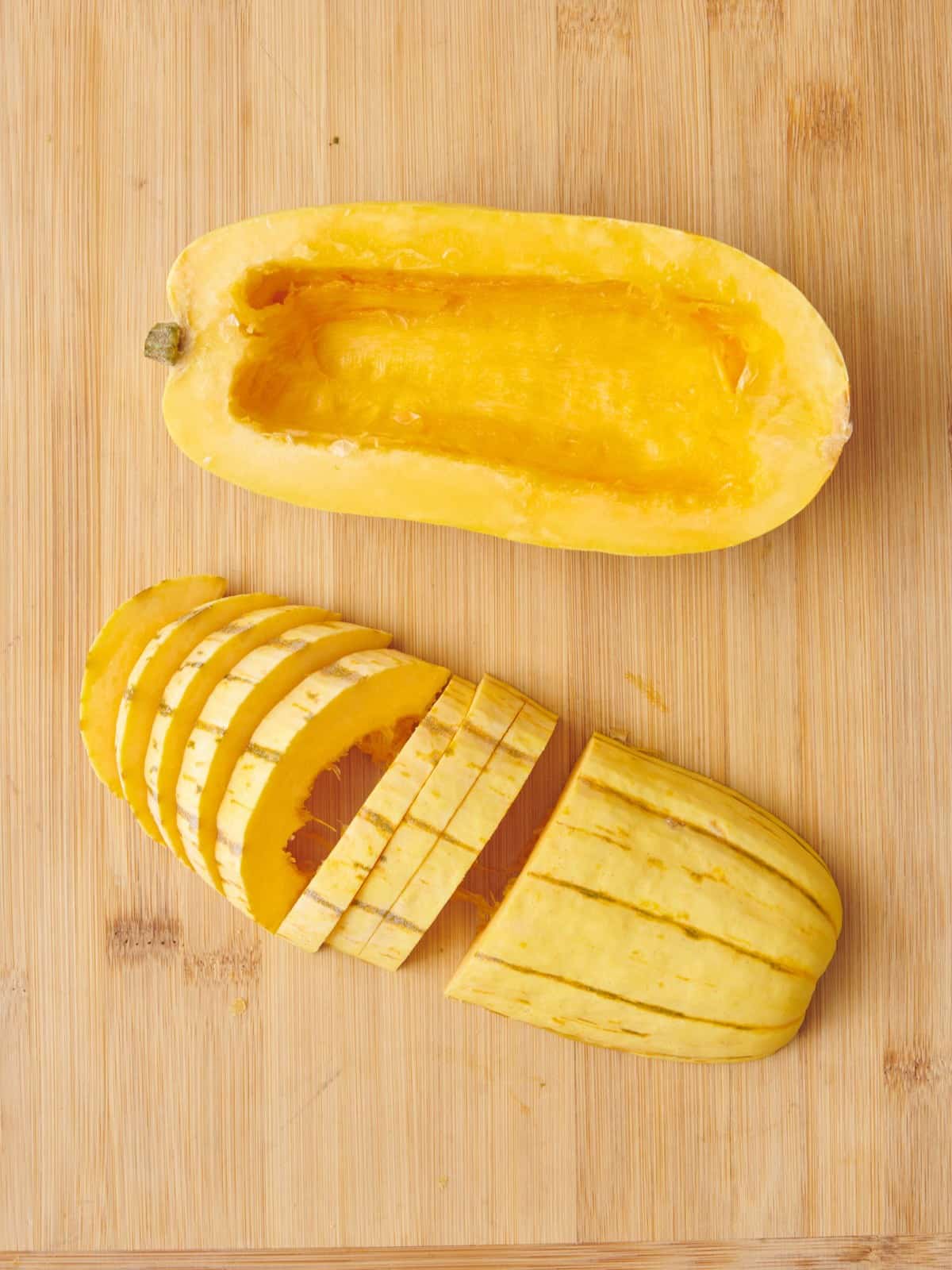 Half a squash cut side down slicing into ยผ inch thick slices.