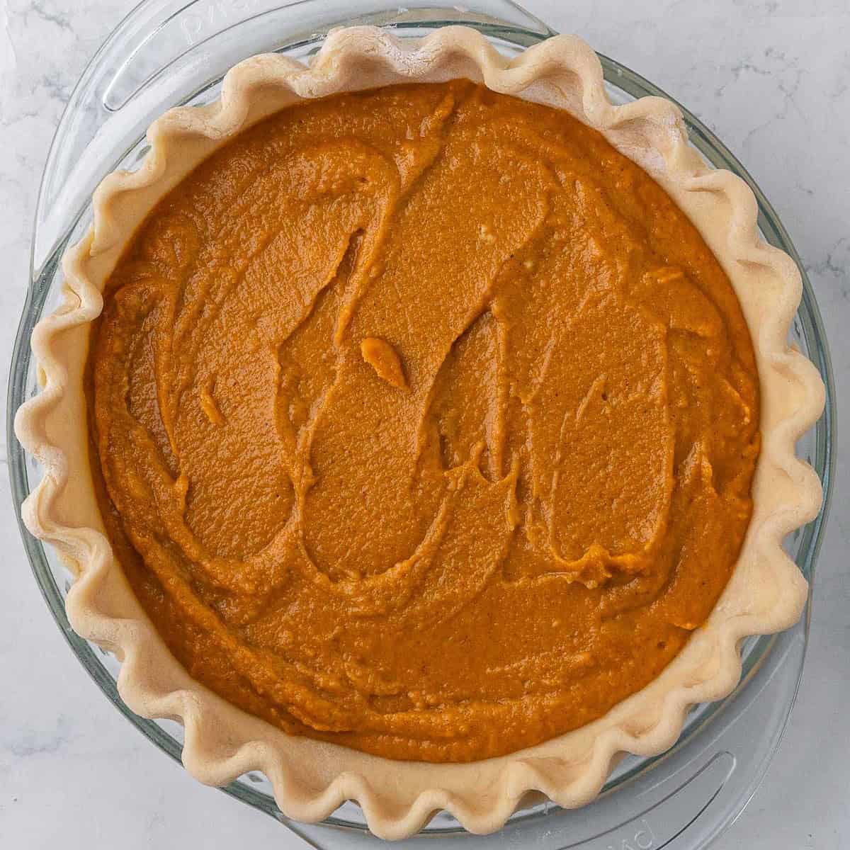 Filling added to pie crust before baking.