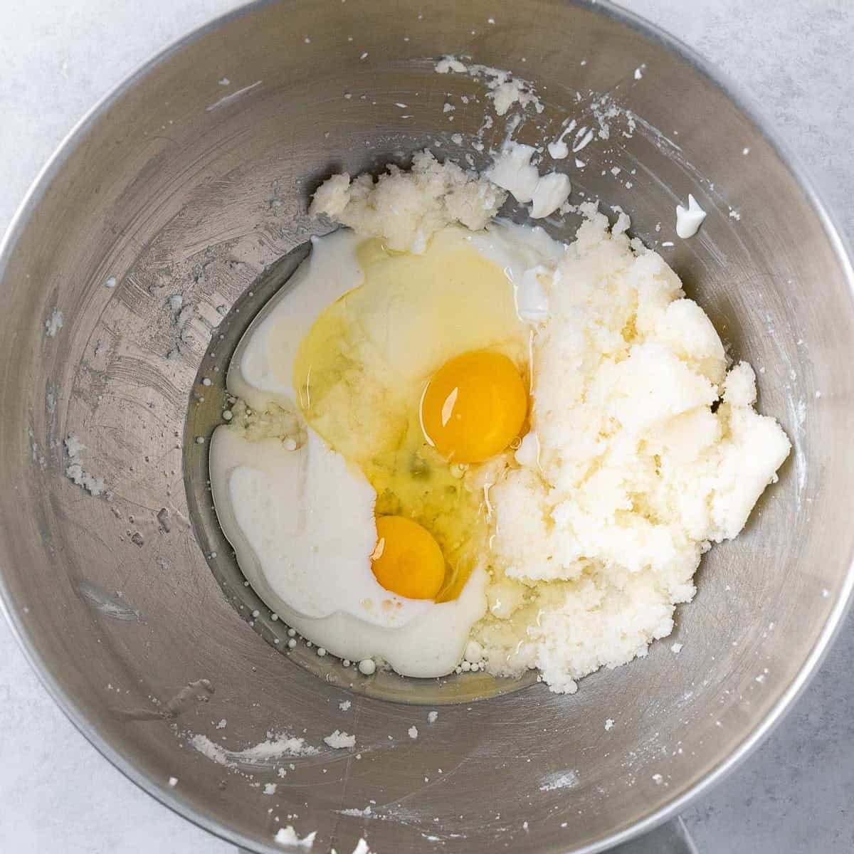 After creaming with eggs, yogurt, oil, milk, and vanilla added.