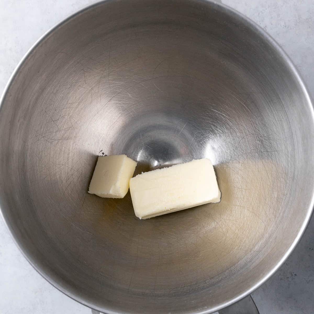 Butter added to cleaned stand mixer bowl.