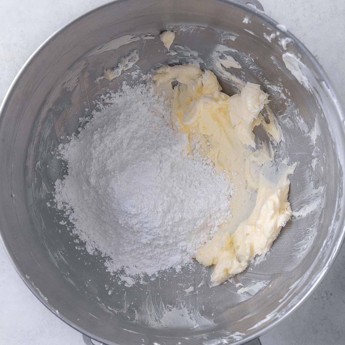 Butter whipping with sides scraped down and powdered sugar added.