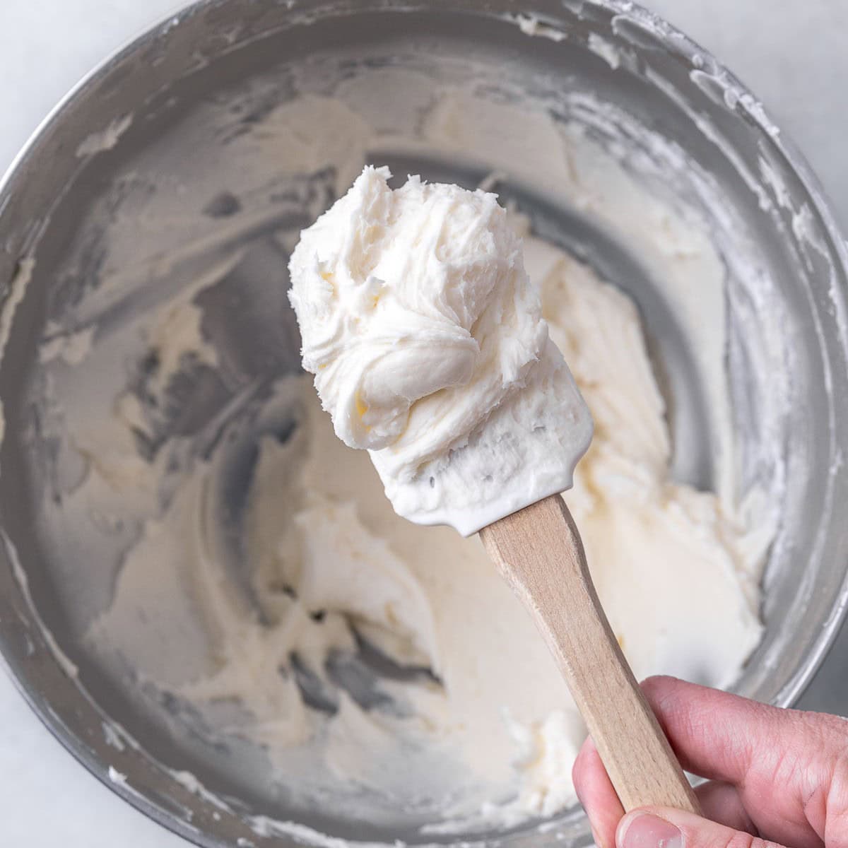 After whipping with a spatula holding a scoop up close to show consistency.