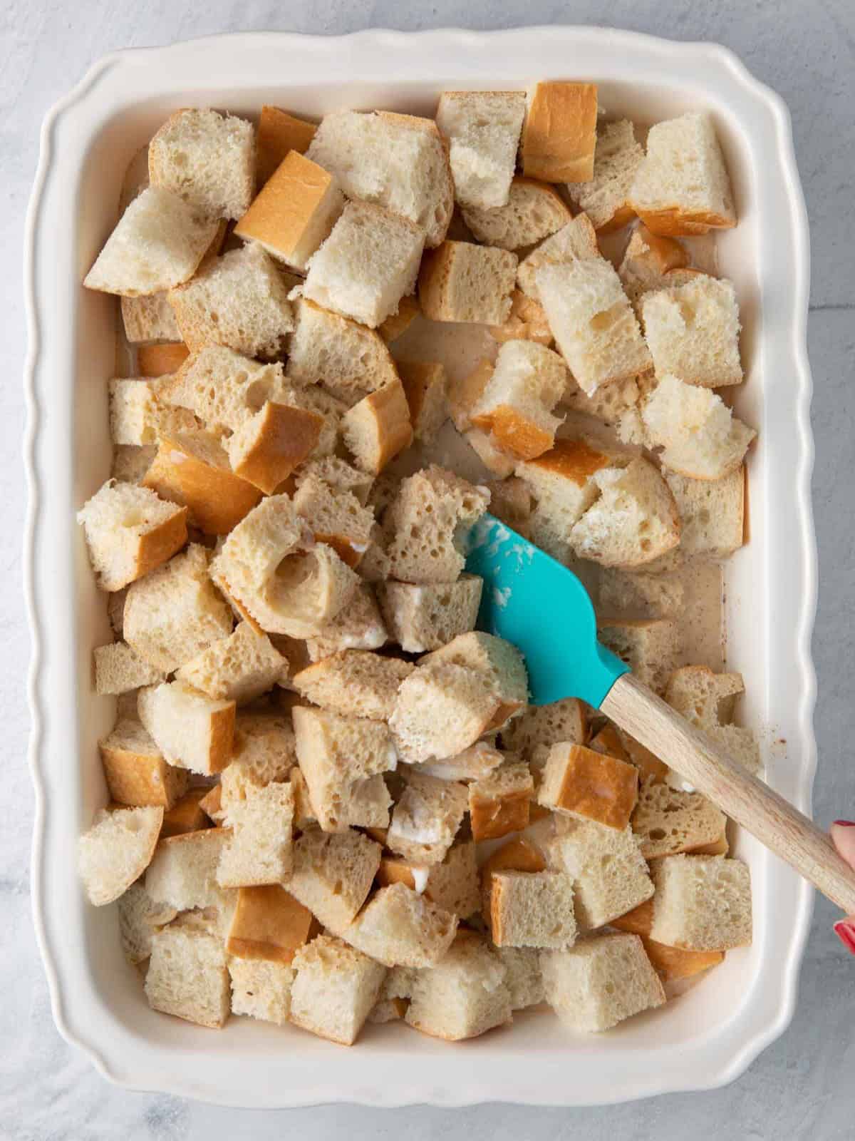 Mixing bread with batter.