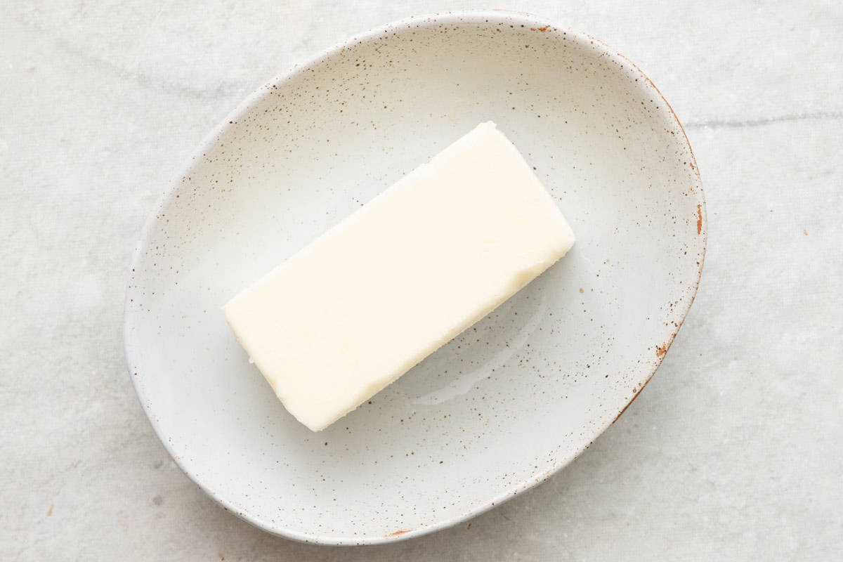 Stick of butter in an oval dish.