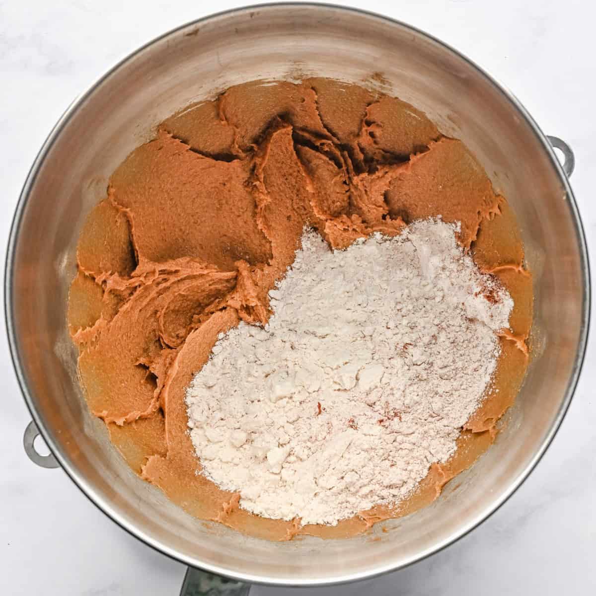 Iced oatmeal cookie dry ingredients added to the bowl.