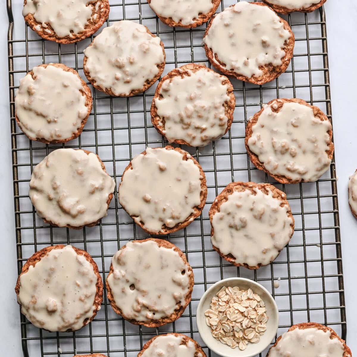 Iced cookie on a wire rack.
