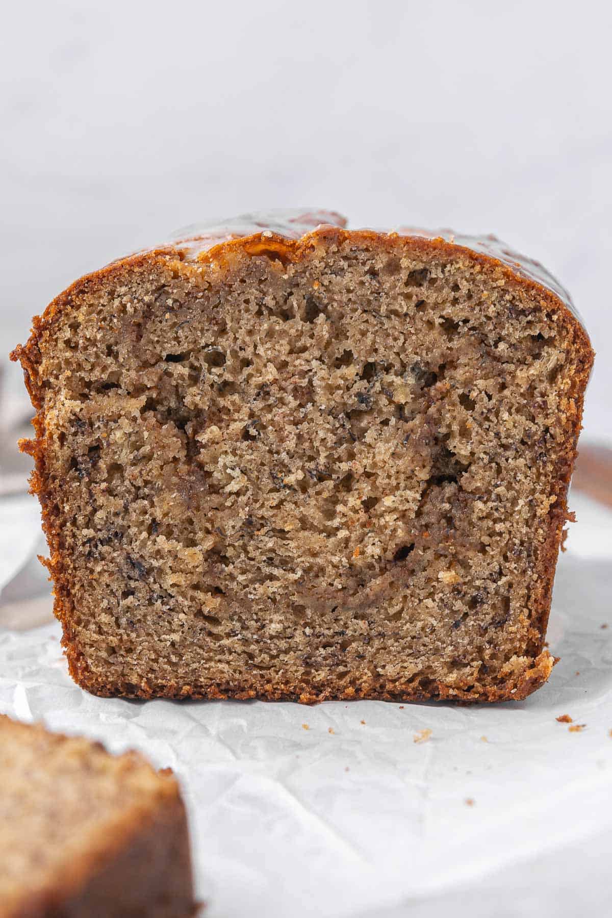 Closeup of the inside of a cinnamon swirl banana bread loaf.