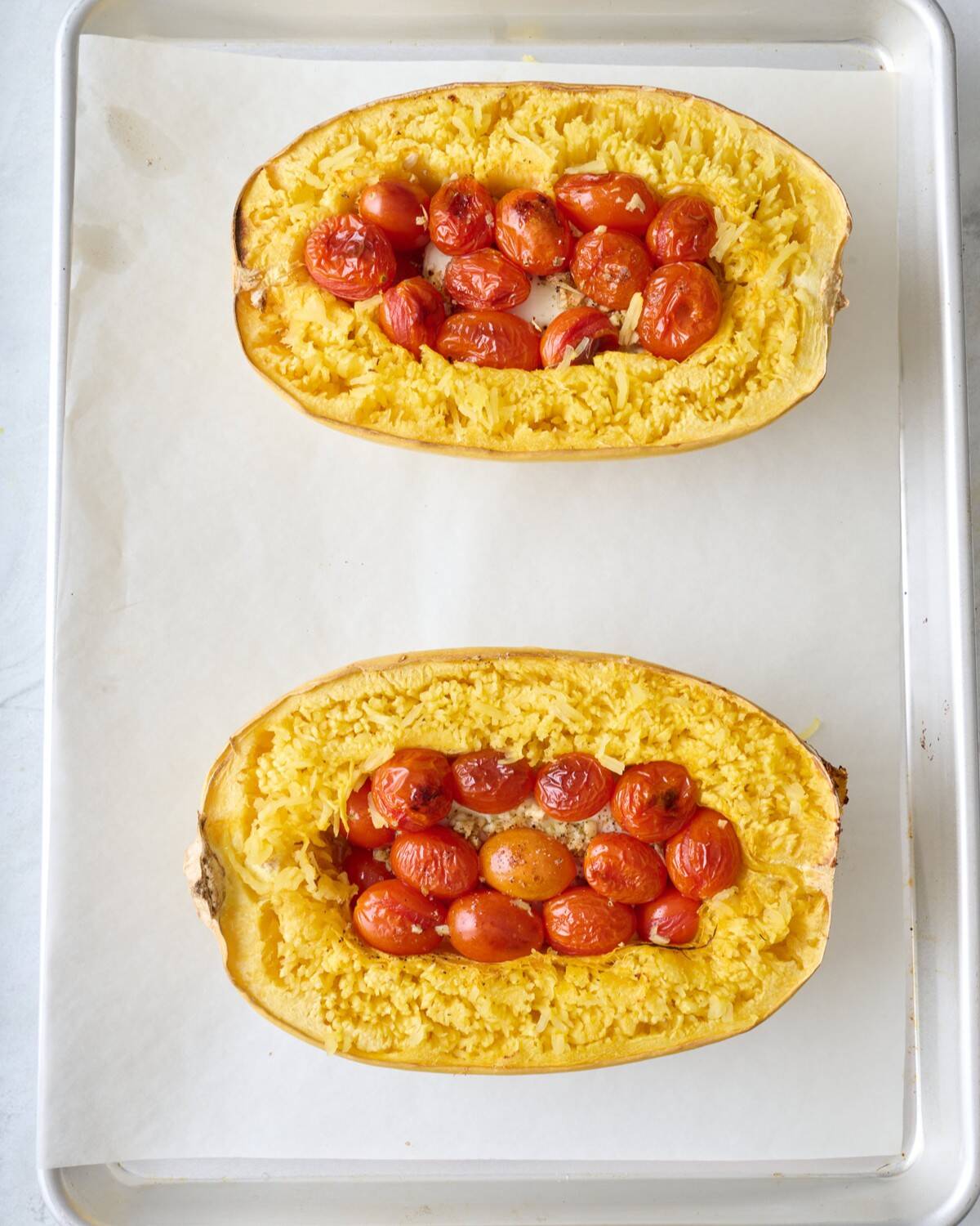 Feta spaghetti squash after pulling apart the squash's sides to create the spaghetti.