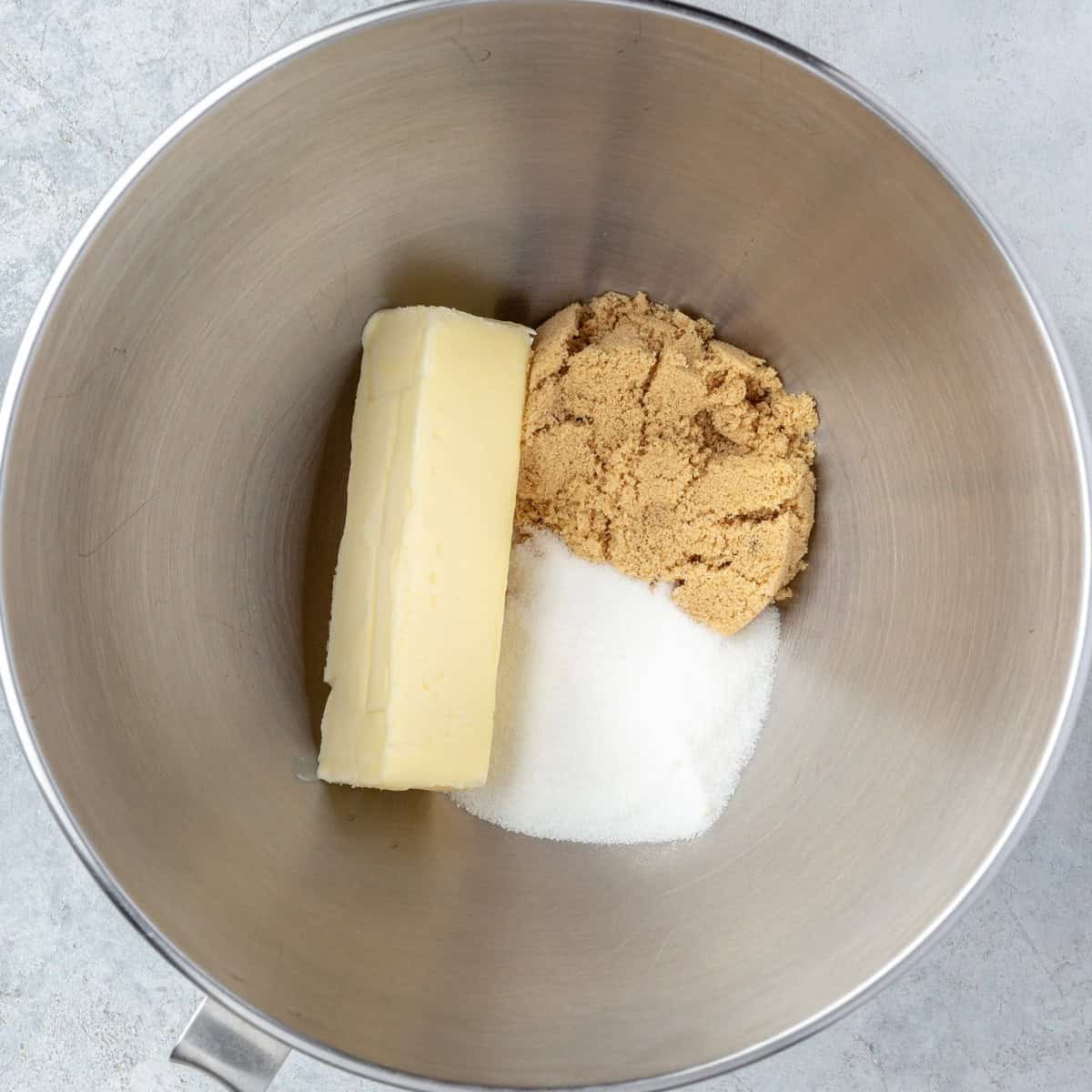 Butter and both sugars in the bowl of a stand mixer before creaming together.