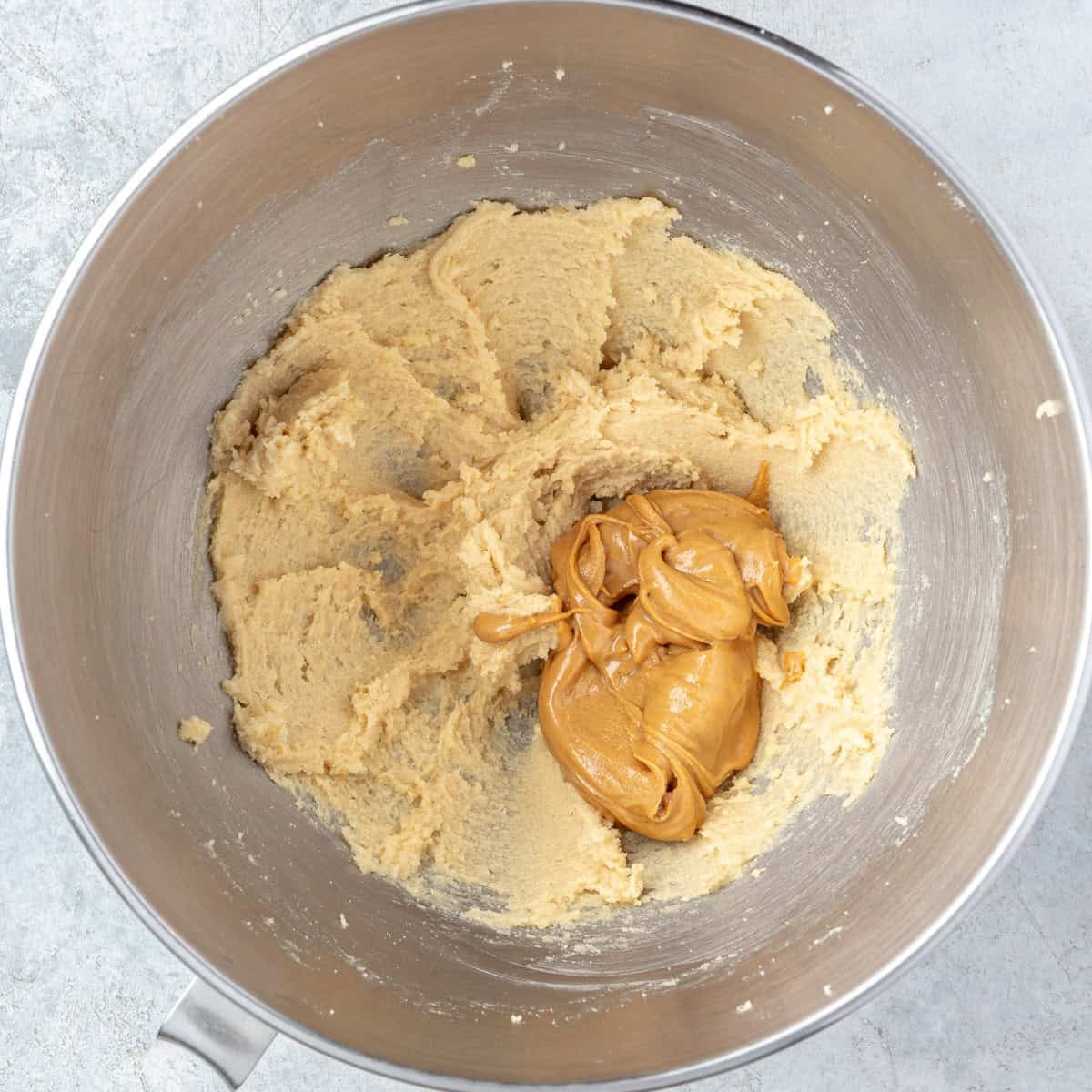 After creaming with peanut butter added before mixing.