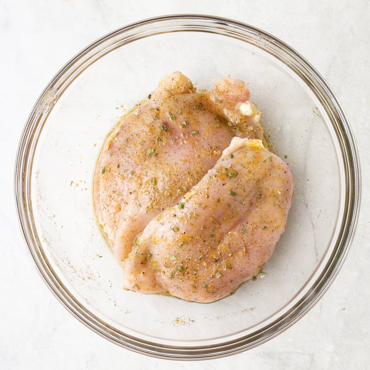 After mixing with chicken breast added and fully coated in seasoning.