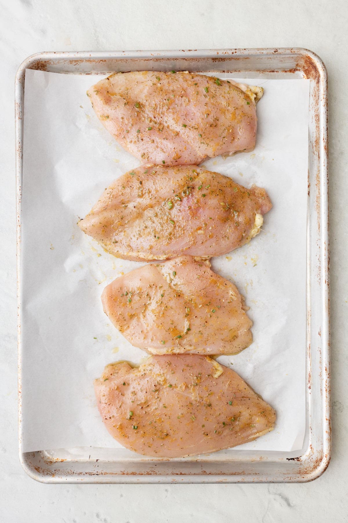Chicken on baking sheet before baking.