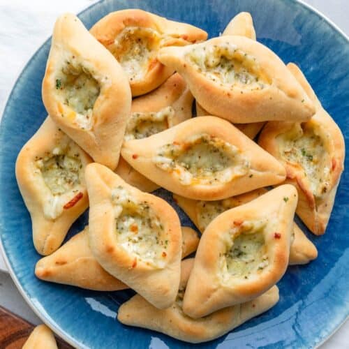 Cheese fatayer on a plate.