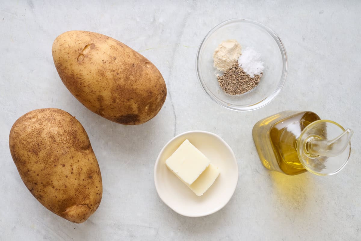 Ingredients for recipe: Potatoes, olive oil, butter, salt, pepper, and onion powder.