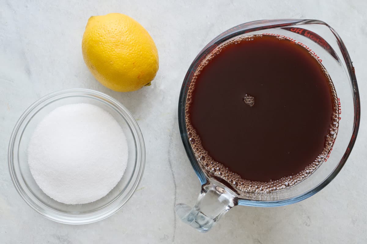 Ingredients for recipe: sugar, lemon, and pomegranate juice.