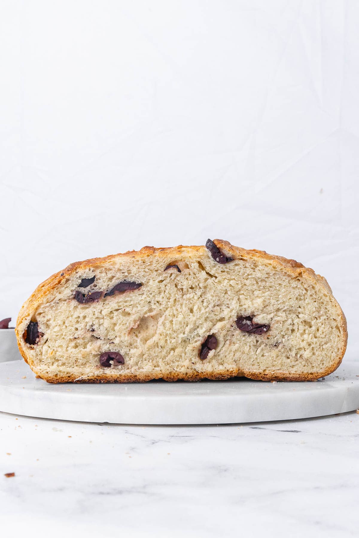 Closeup of a slice of olive bread.