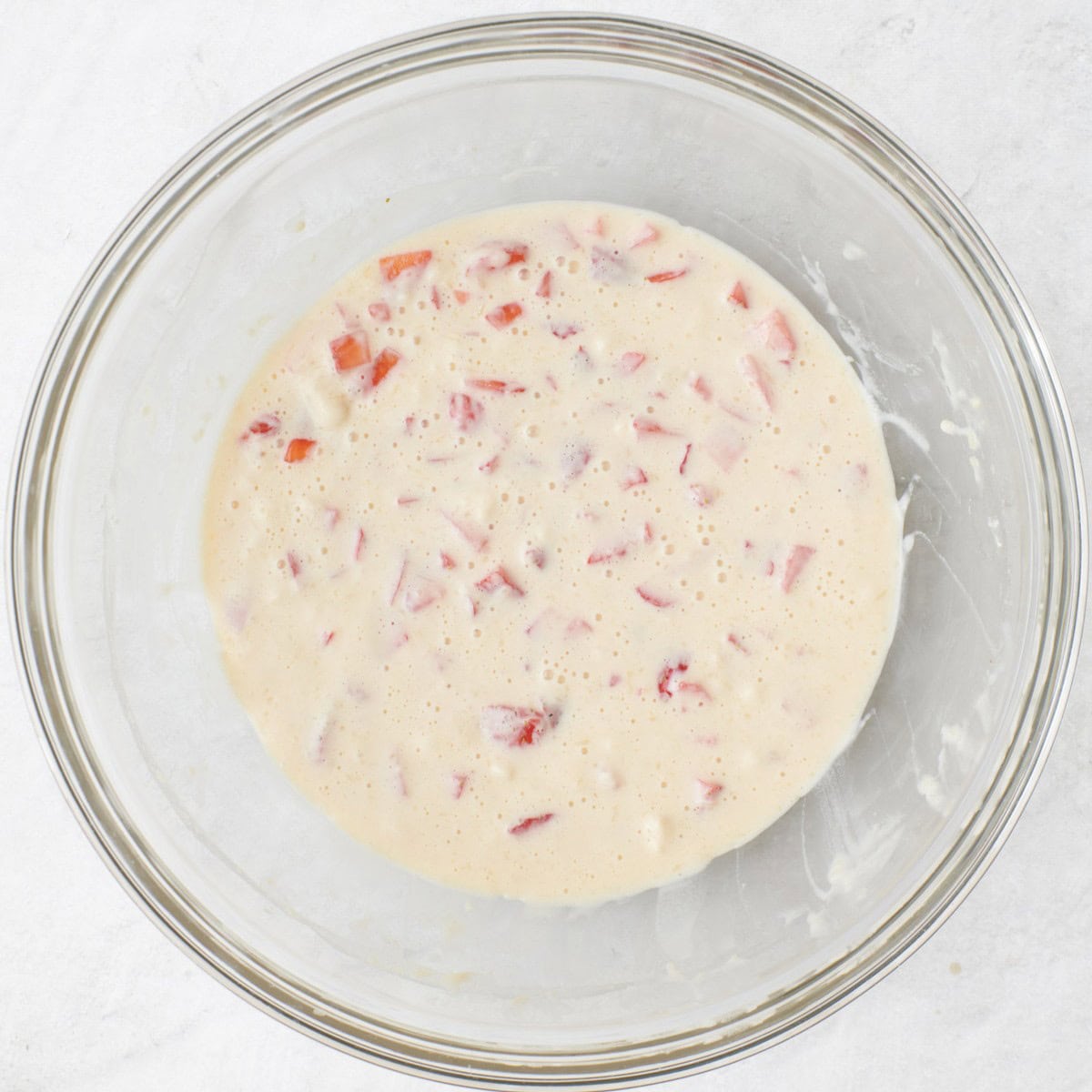 Batter mixed together with the strawberries.