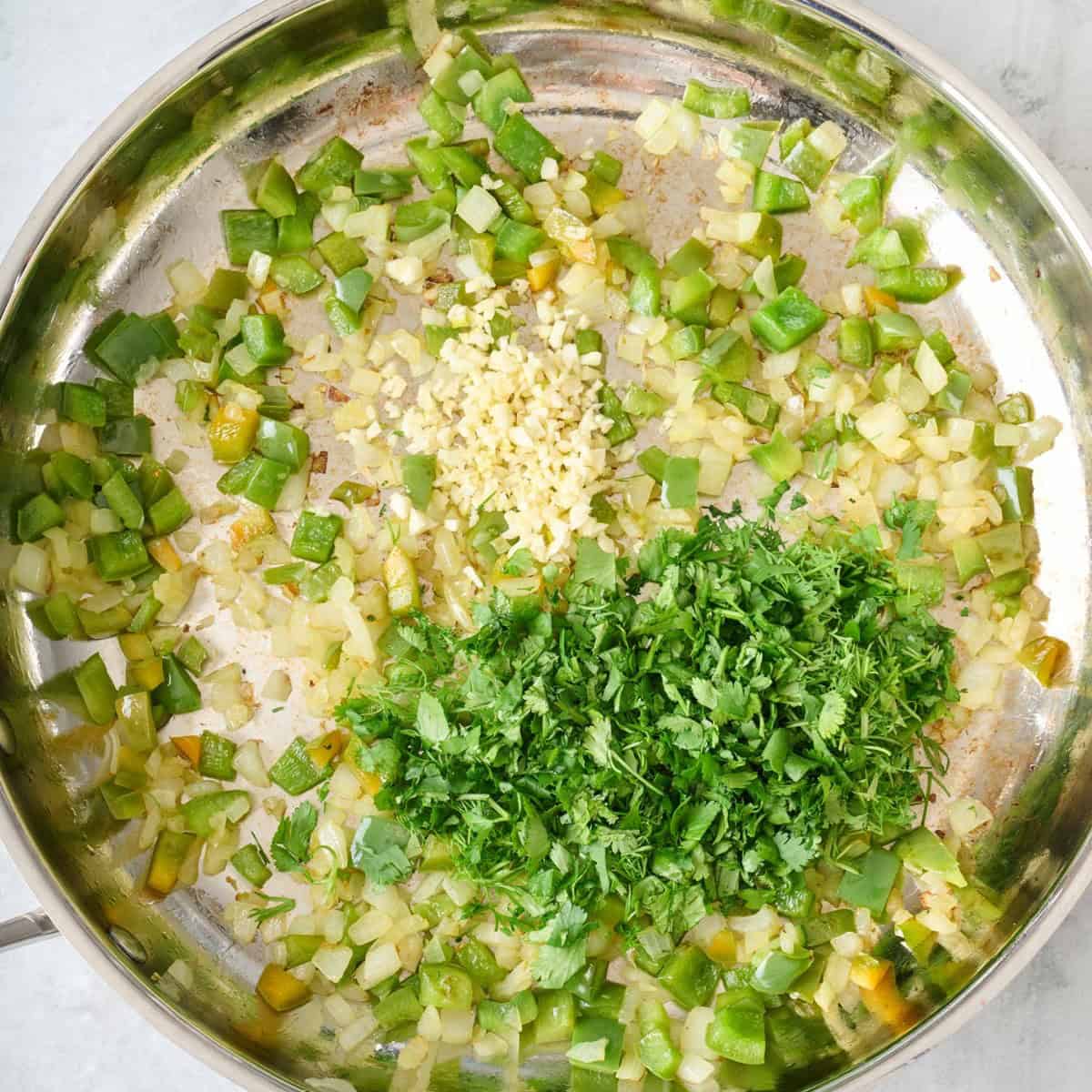 After cooking with garlic, cilantro and dill added.