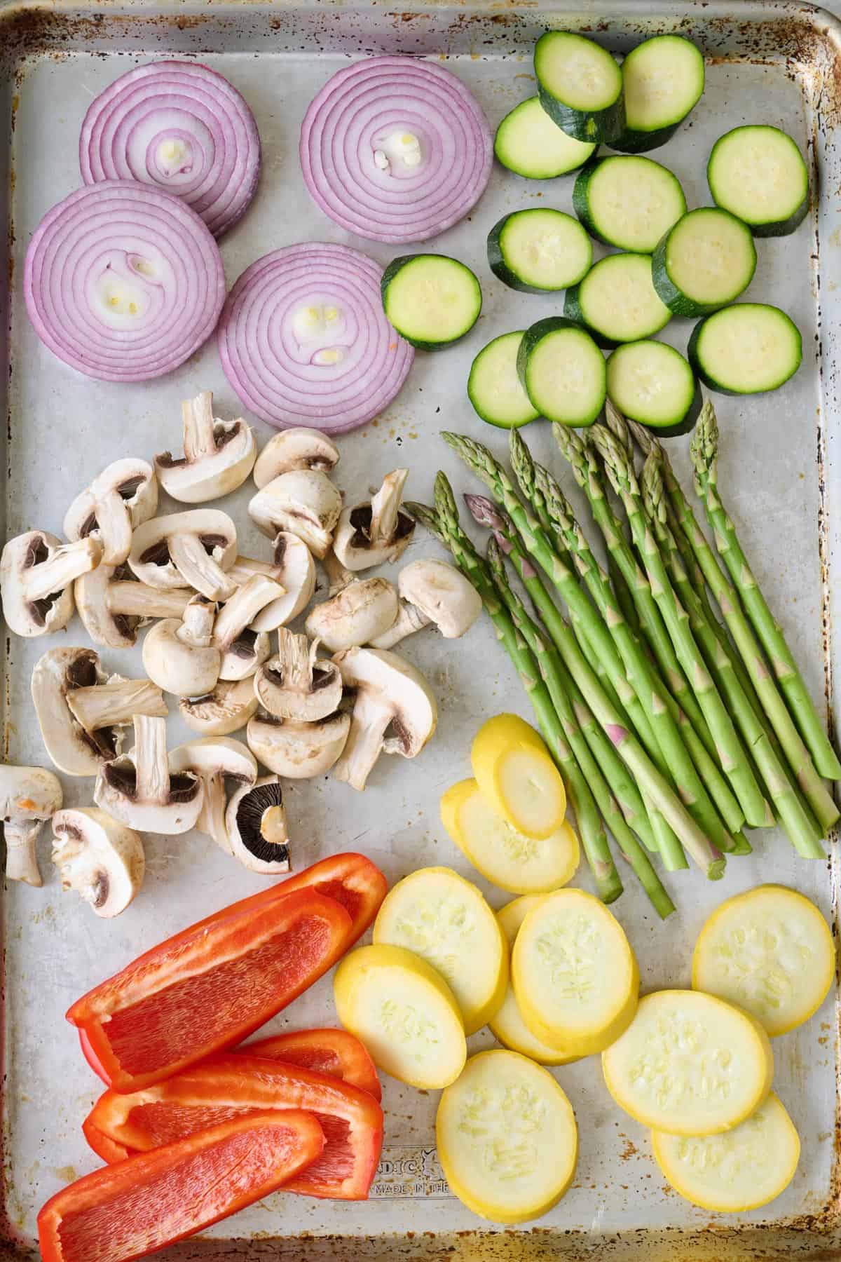 Prepared vegetables on a baking sheet.