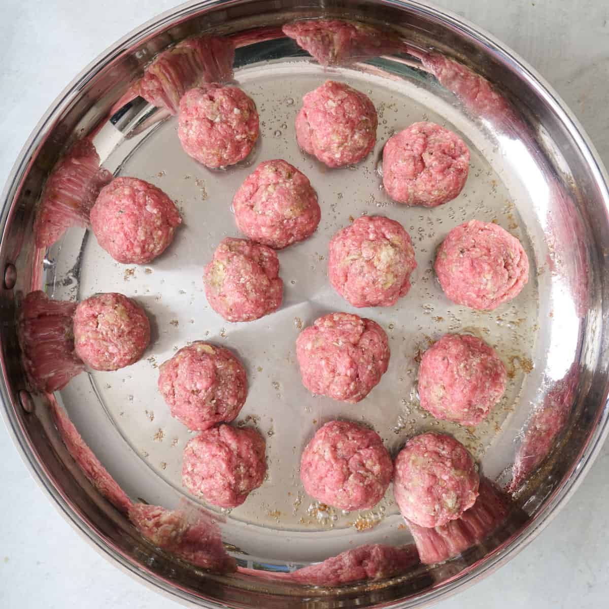 Meatballs in a skillet.