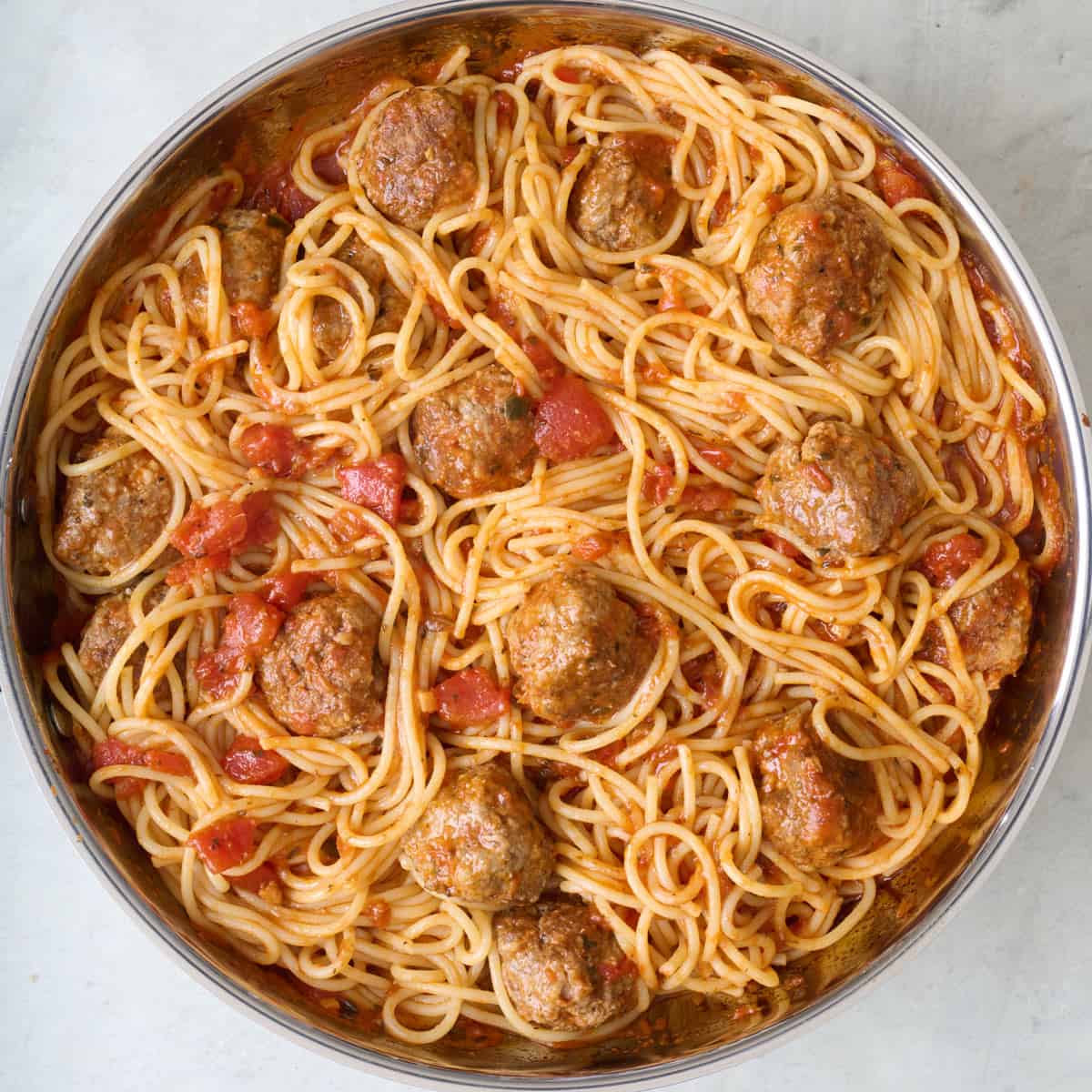 Spaghetti tossed with sauce and beef.