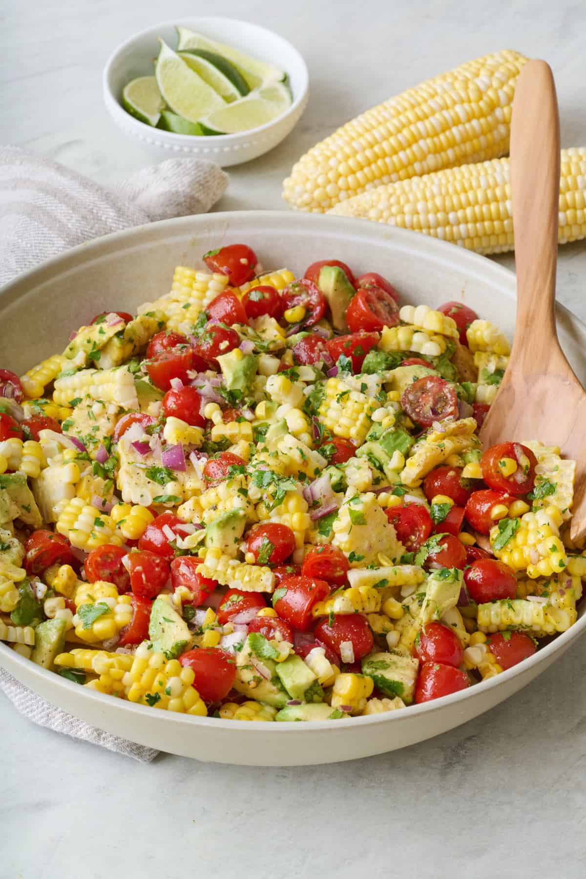 Corn tomato avocado salad in a serving bowl.