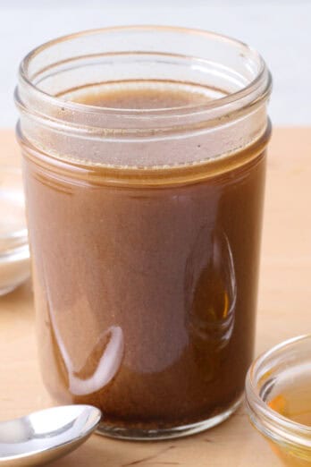 Homemade balsamic vinaigrette recipe in a small jar.
