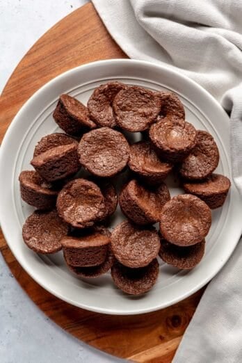Brownie bites on a white plate.