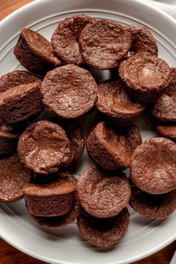 Brownie bites on a white plate.