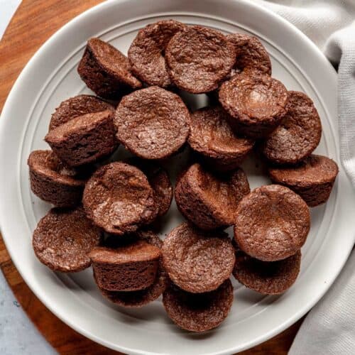 Brownie bites on a white plate.