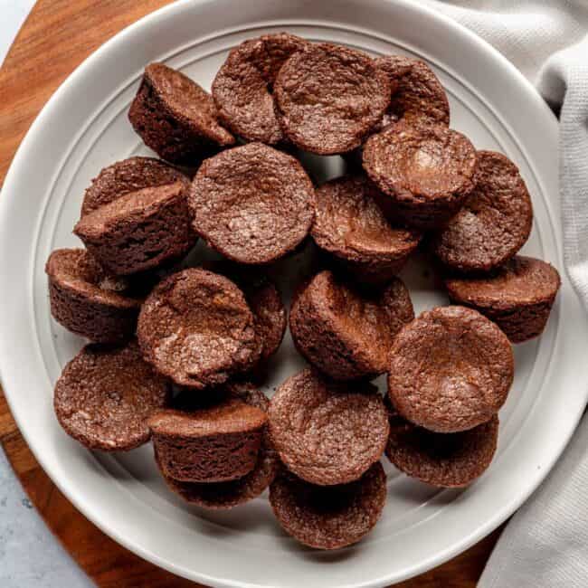 Brownie bites on a white plate.