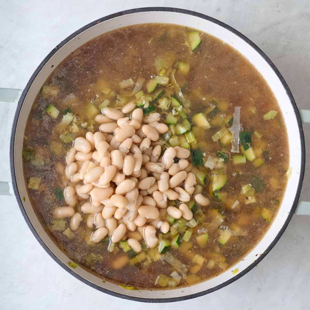 Zucchini soup ingredients in a pot.