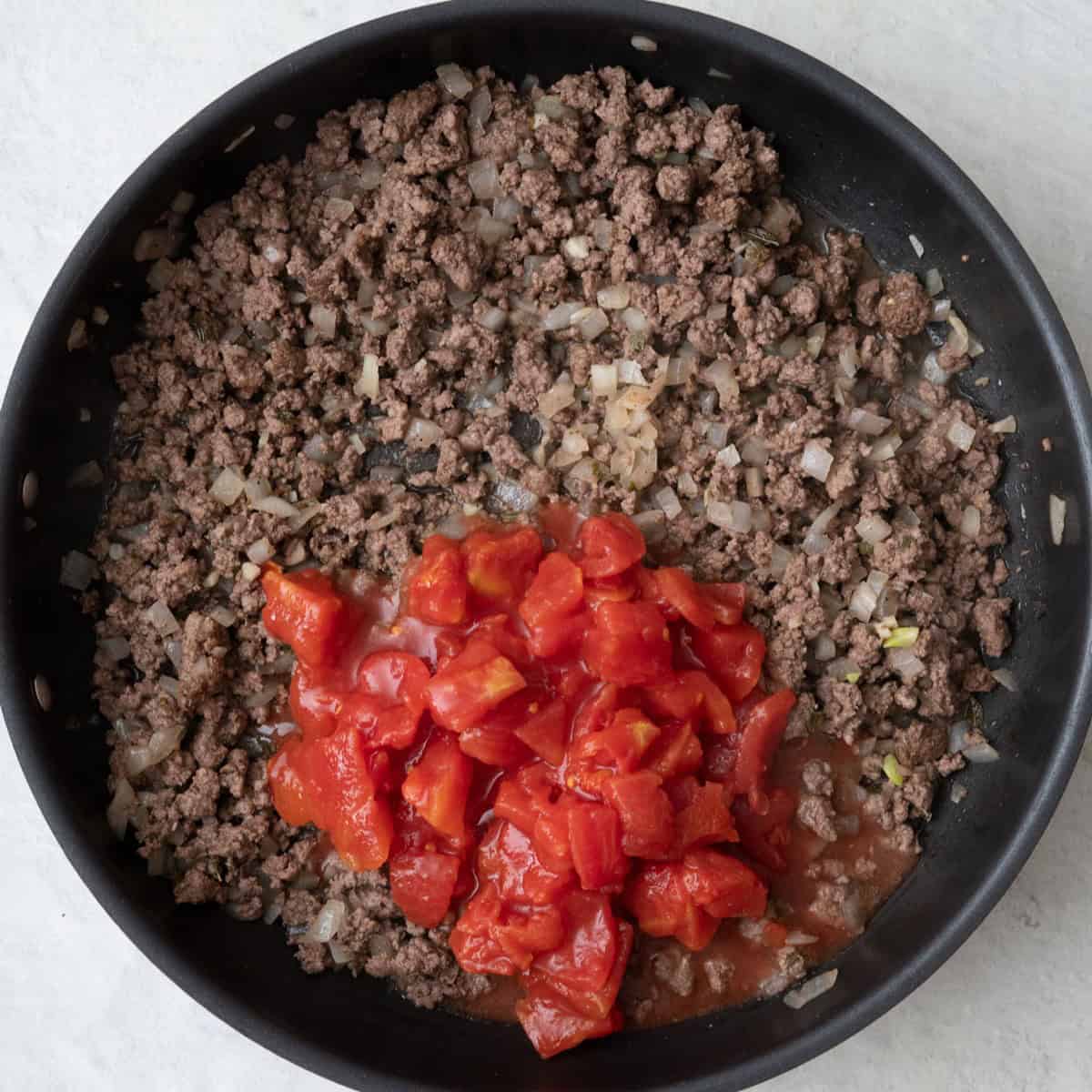 Diced tomatoes added.