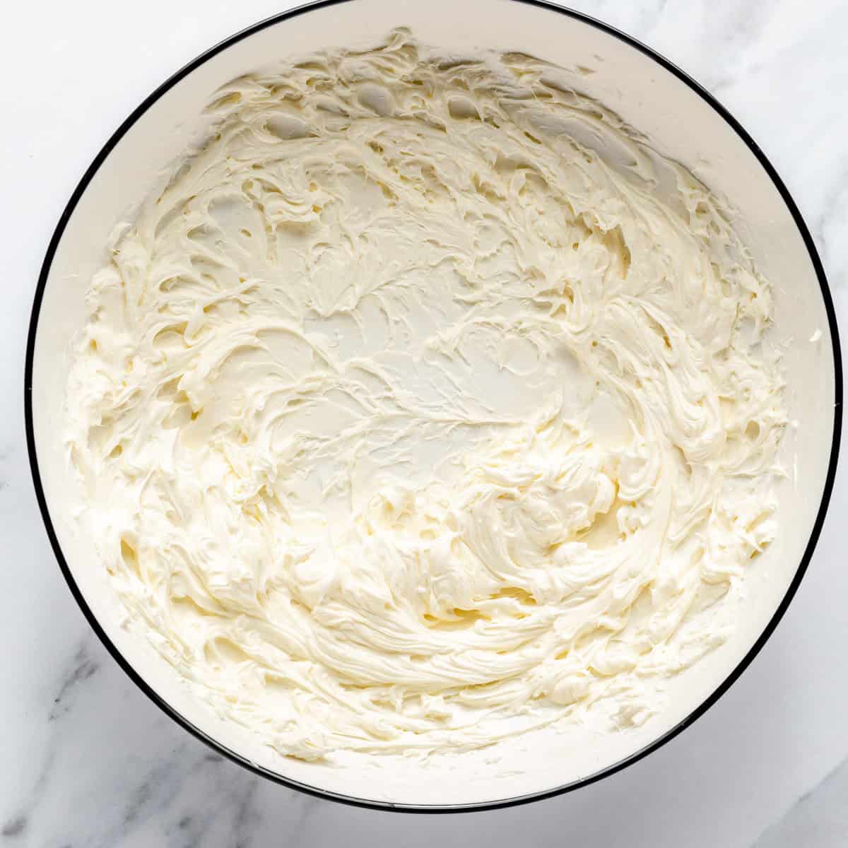 Whipped cream cheese in a mixing bowl.