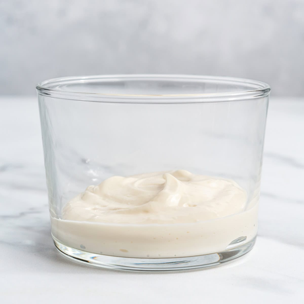 The cream cheese-yogurt mixture in. a serving glass.