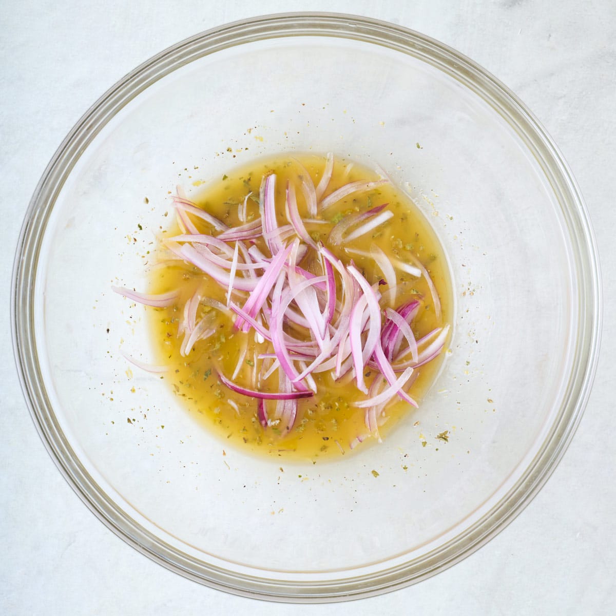 Dressing with red onions added.