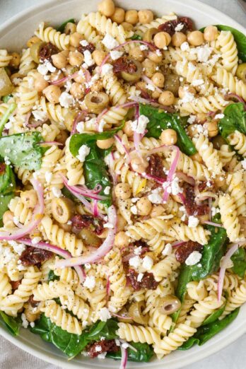 Sun-dried tomato pasta salad in a bowl.