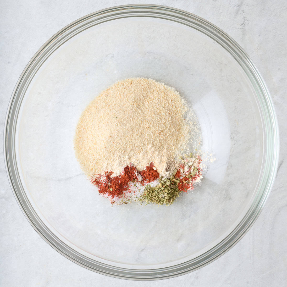 Breadcrumbs and seasonings in a bowl before mixing.