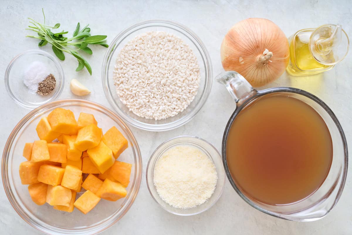 Ingredients for recipe: butternut squash cubes, parmesan cheese, rice, vegetable broth, onion, oil, salt, pepper, garlic, and sage.