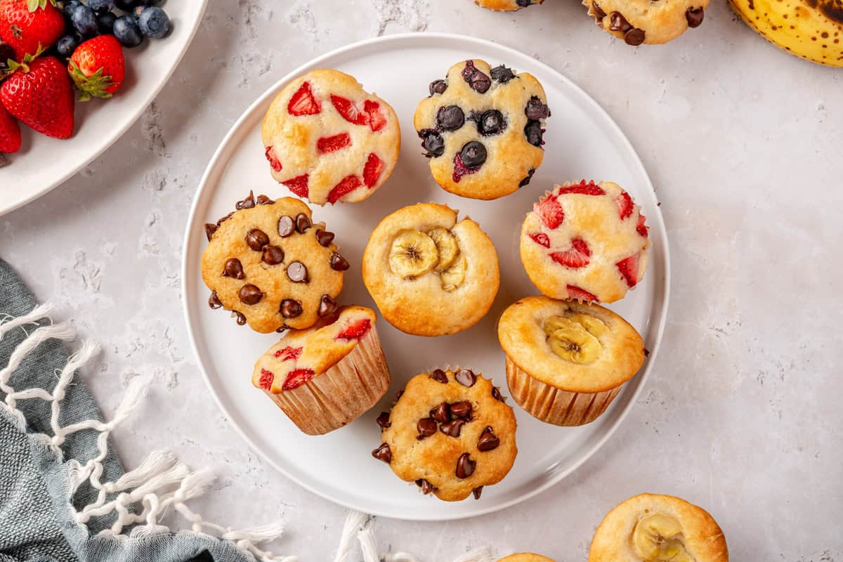 Variety of pancake muffins with different toppings on a plate.