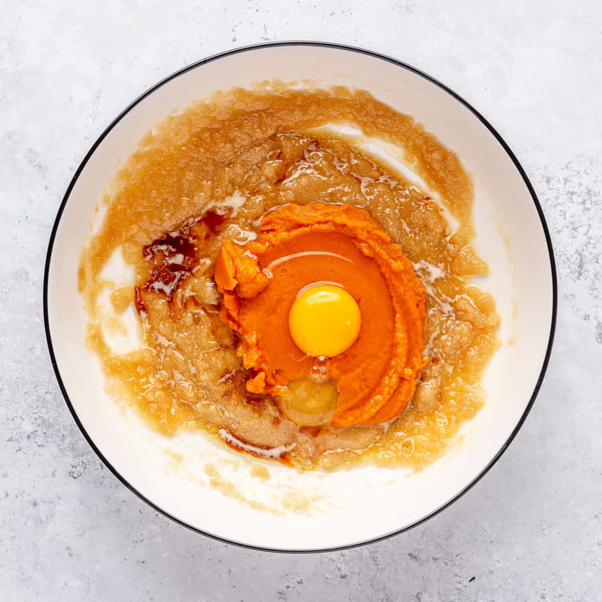 After mixing sugars with egg, pumpkin puree, and vanilla added.