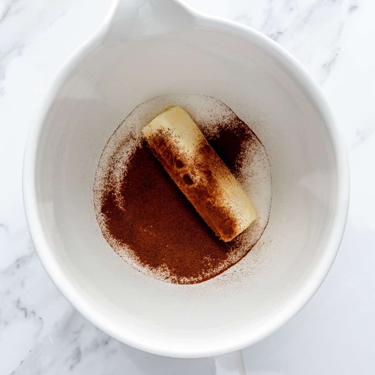Softened butter, sugar and instant coffee in the bowl of a stand mixer.
