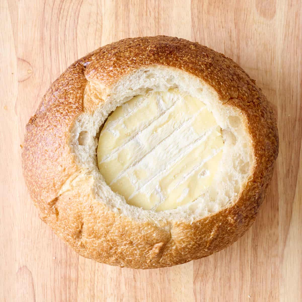 Brie wheel placed inside bread cavity.