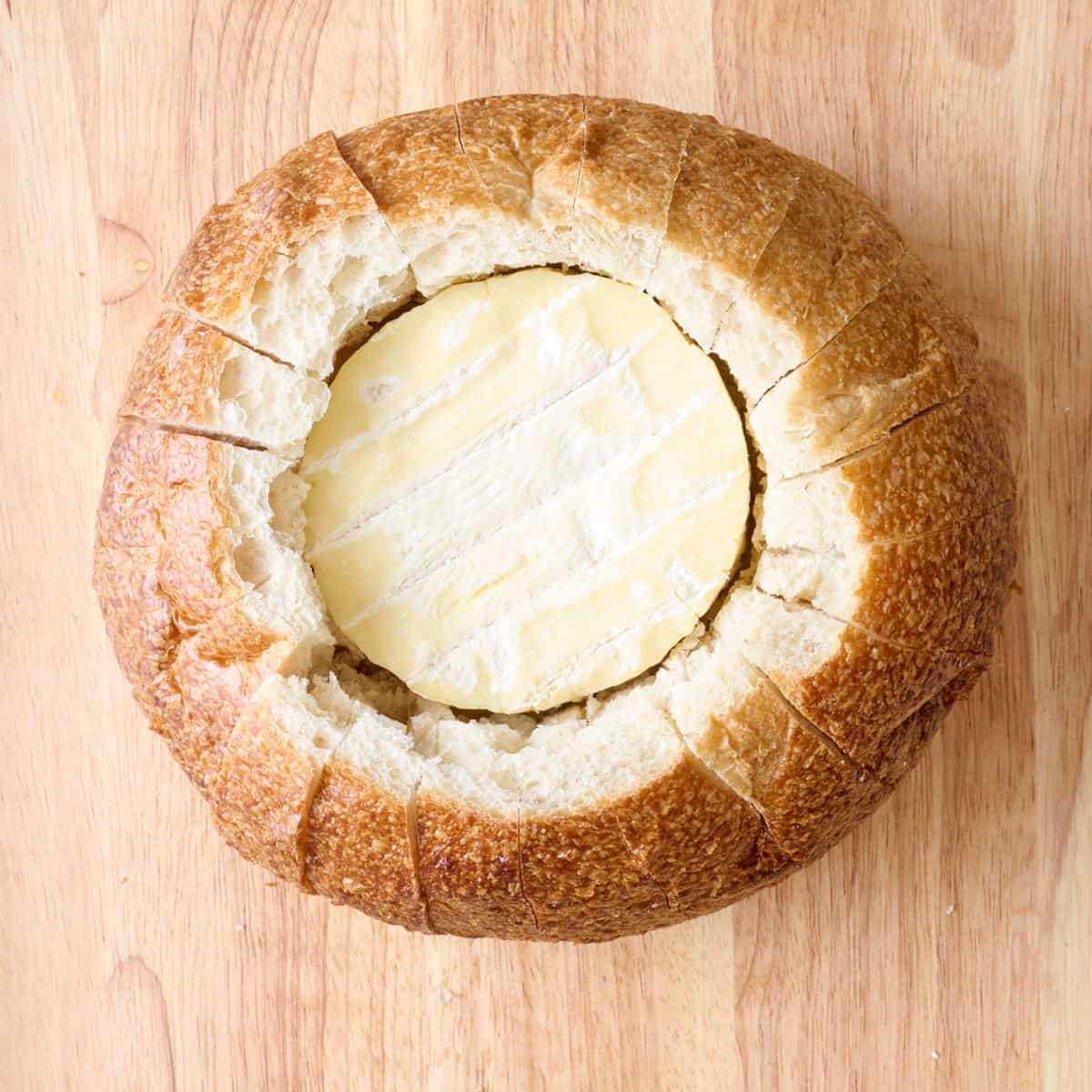 After slicing the edges of the bread down vertically.