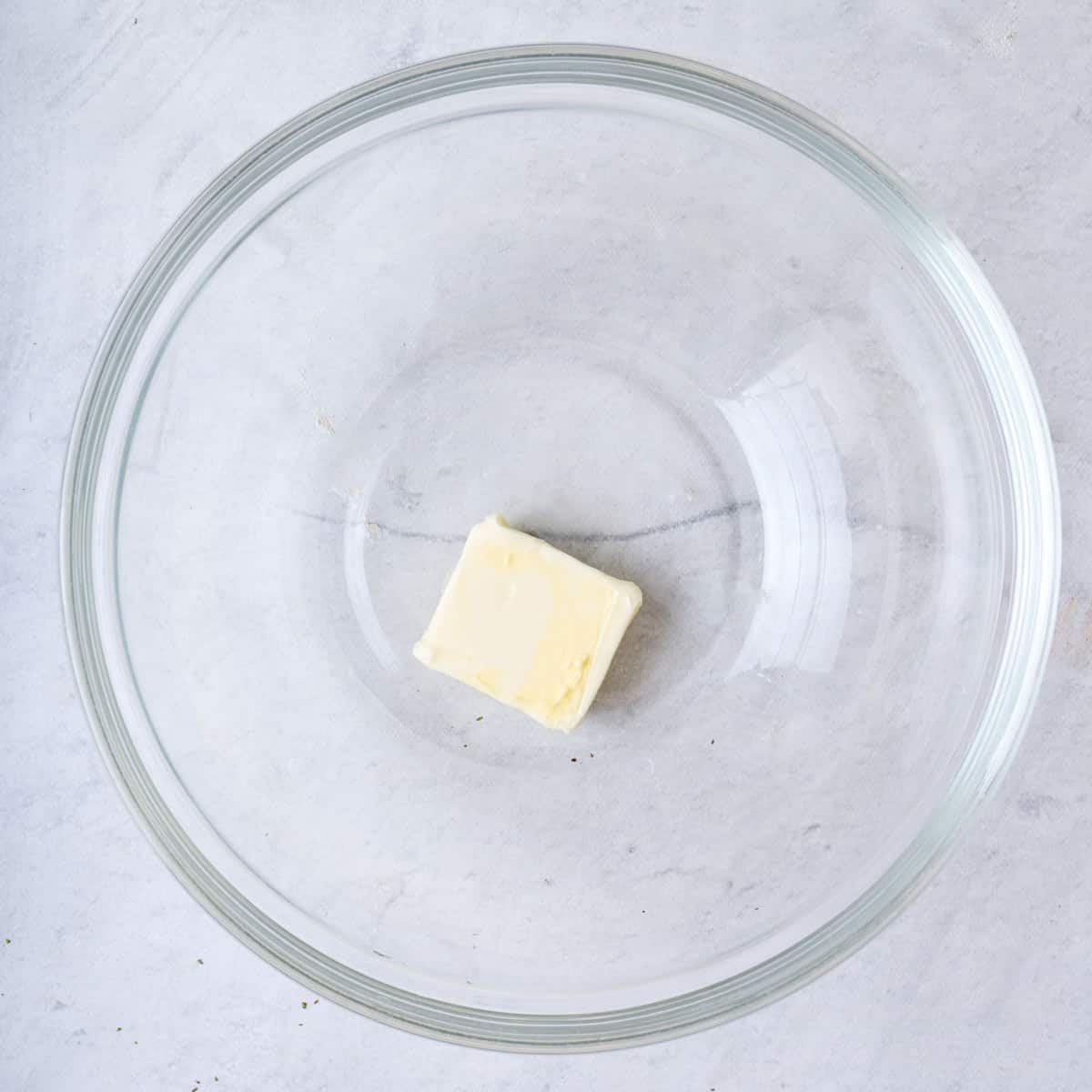 Pat of butter in a bowl.