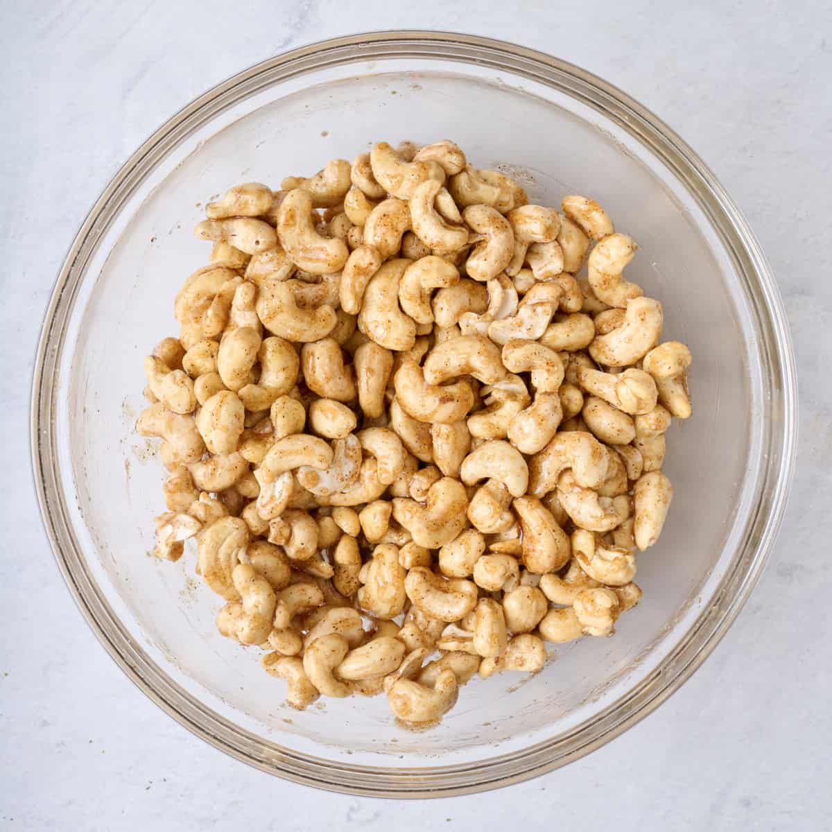 After tossing nuts with butter and sugar mixture.