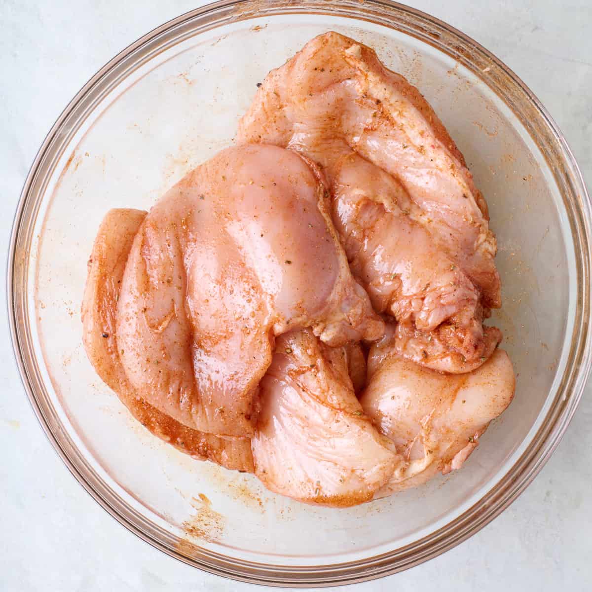 After tossing chicken with spices.