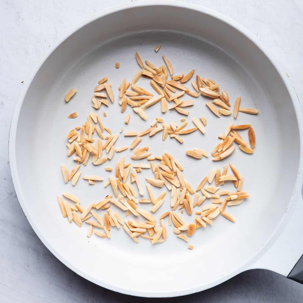 Cooked almonds in a pan.