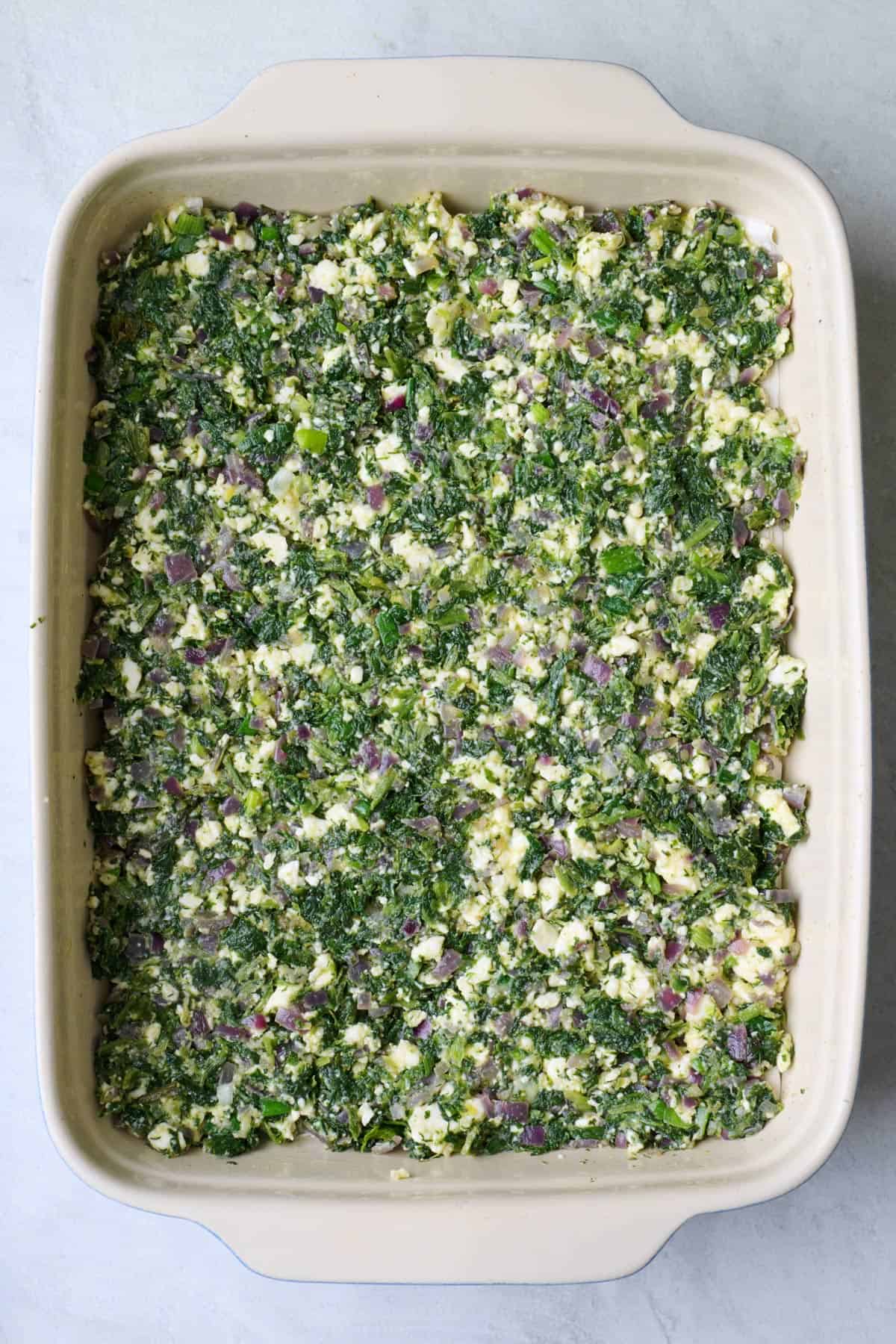 Even layer of spinach mixture added.